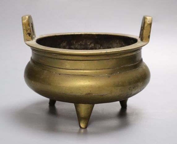 A Chinese two handled bronze censer, 16cm diameter